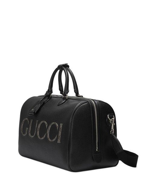 Borsone con logo goffrato di Gucci in Black