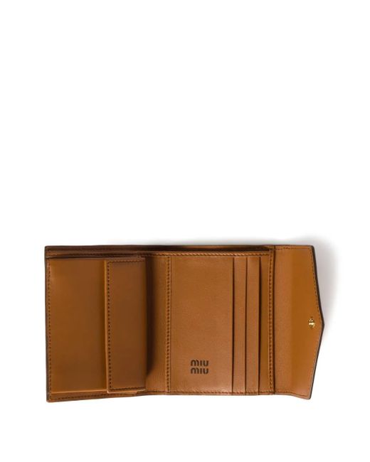 Cartera con logo en relieve Miu Miu de color Brown