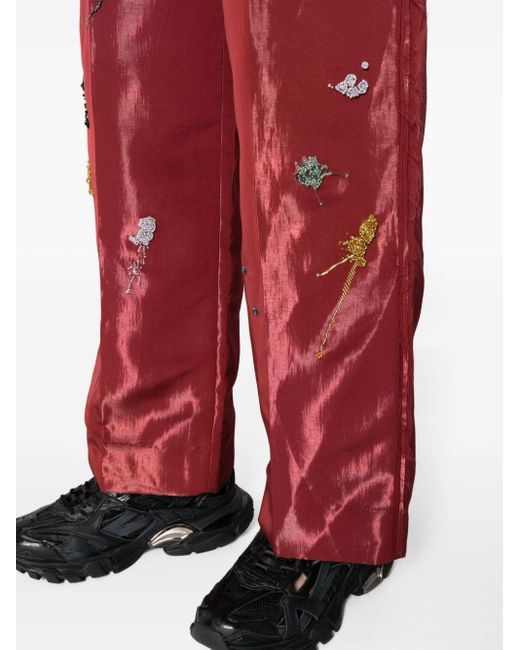 Pantaloni a gamba ampia con ricamo di Undercover in Red
