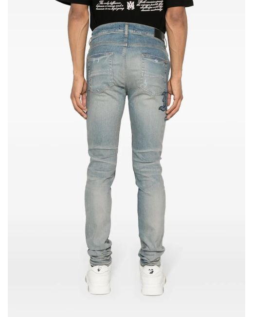 Amiri Blue Distressed Skinny Jeans for men