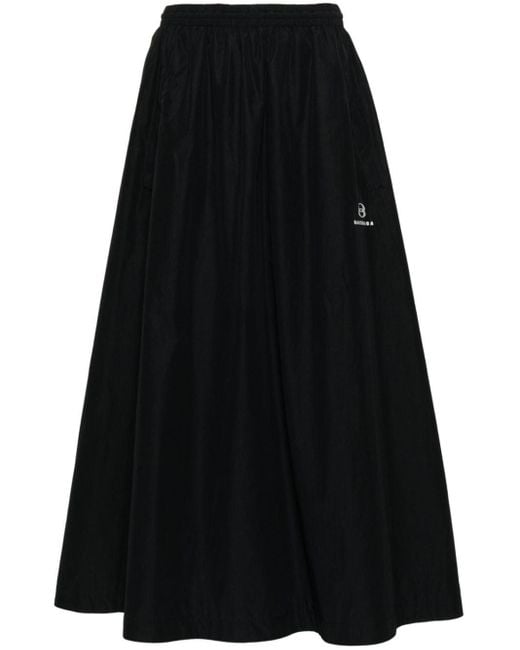 Jupe longue à logo brodé Balenciaga en coloris Black