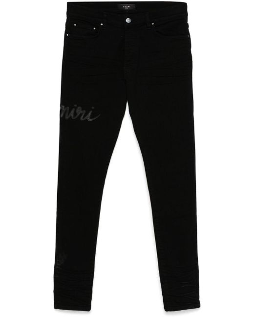 Jeans Skinny Con Logo Script di Amiri in Black da Uomo