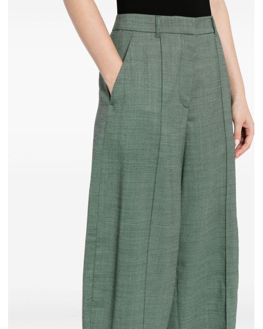 Pantalon fuselé en laine à plis Stella McCartney en coloris Green