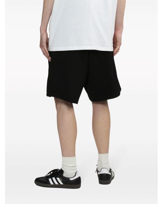 Pantalones cortos de chándal con logo Izzue de hombre de color Black