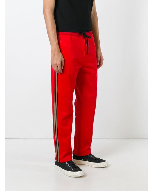 trousers with red side stripe