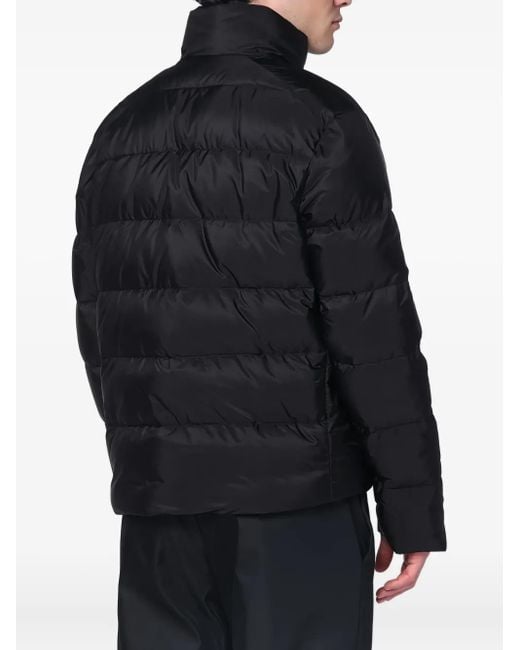 Plumífero con logo triangular Prada de hombre de color Black
