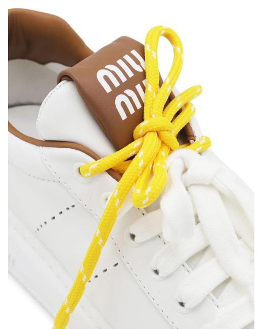 Miu Miu Metallic Sneakers mit dicker Sohle
