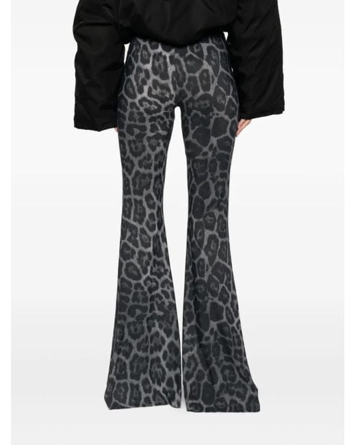 Leopard-print flared trousers Stella McCartney de color Black