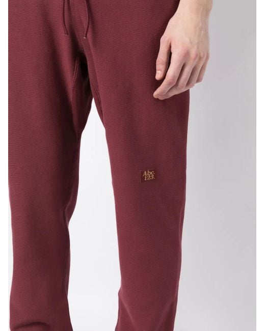 Advisory Board Crystals Red Logo-Patch Track Pants for men