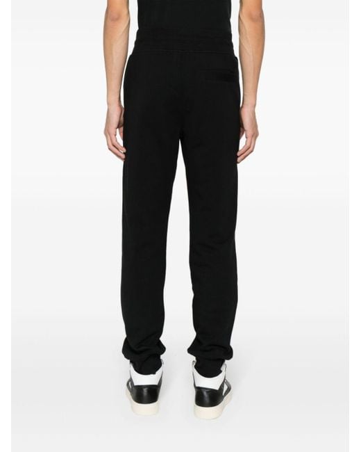 Pantaloni sportivi con applicazione logo di Versace in Black da Uomo