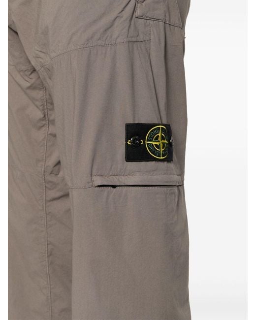 Pantaloni affusolati con applicazione Compass di Stone Island in Gray da Uomo