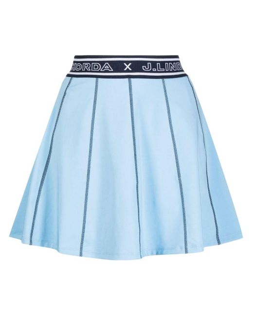 X Nelly Korda minijupe à design plissé J.Lindeberg en coloris Blue