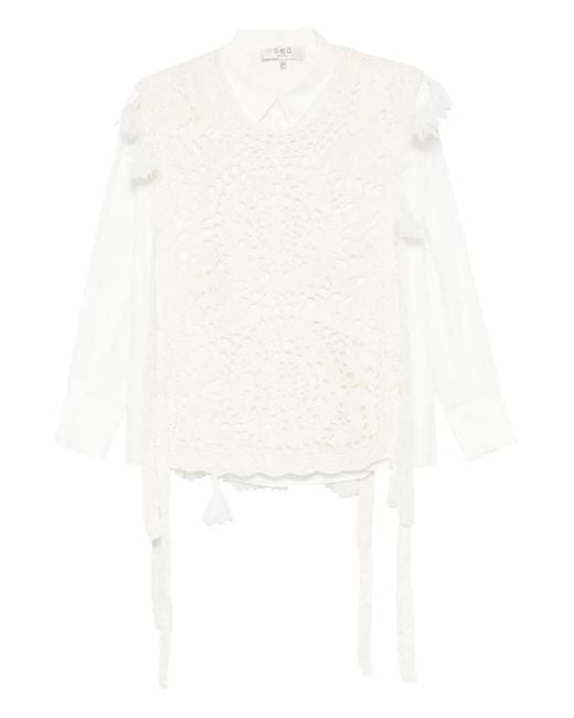 Top con detalle de borlas Sea de color White