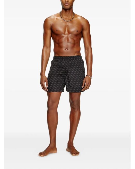 DIESEL Black Mid-Length Swim Shorts With All-Over Logo for men