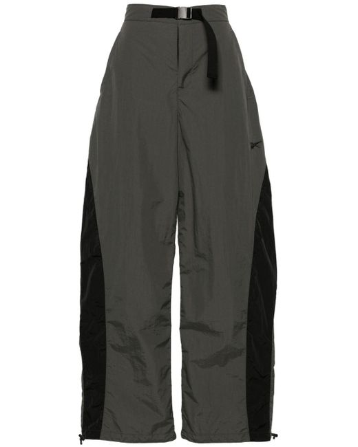 Pantalones anchos a paneles Reebok de color Gray