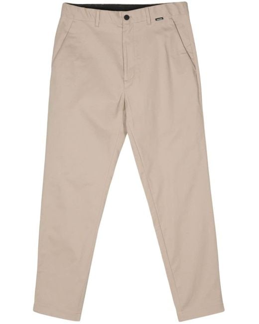 Pantaloni affusolati con logo di Calvin Klein in Natural da Uomo