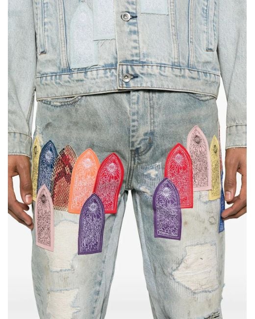 Who Decides War Blue Patch Arched Distressed Jeans for men