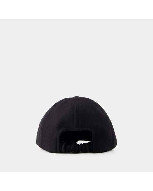 Patou Black Cap