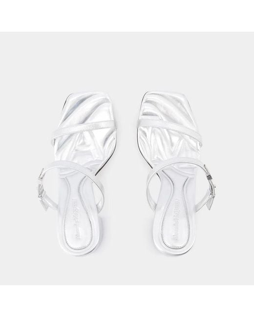 McQueen White Leather Seal Mules