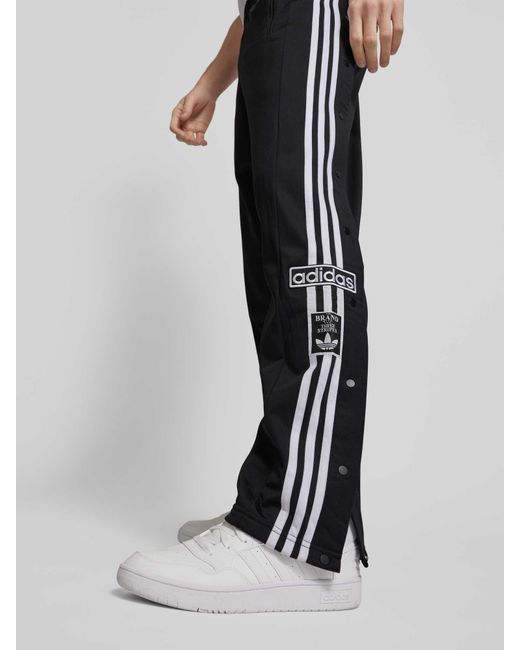 Adidas Originals Regular Fit Sweatpants mit Label-Patches Modell 'ADIBREAK' in Black für Herren