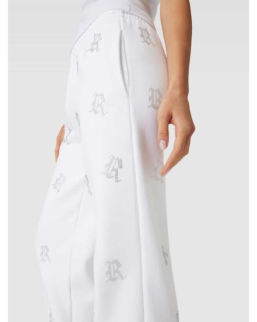 Review White Sweatpants mit Allover-Logo-Print aus Ziersteinen