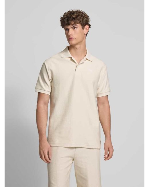 PUMA Relaxed Fit Poloshirt mit Label-Stitching in Natural für Herren