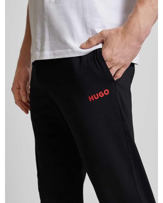 HUGO Loose Fit Sweatpants mit Label-Print Modell 'Linked' in Black für Herren
