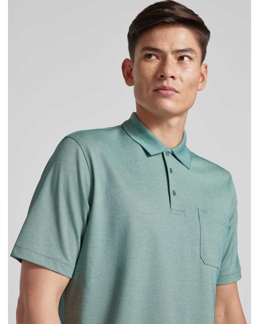 Christian Berg Men Regular Fit Poloshirt mit Brusttasche in Green für Herren