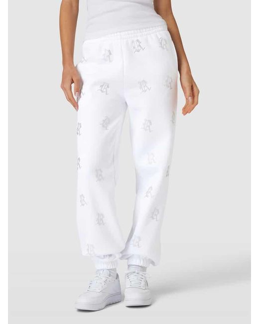 Review White Sweatpants mit Allover-Logo-Print aus Ziersteinen