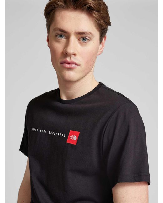 The North Face T-Shirt mit Label-Print Modell 'NEVER STOP EXPLORIN' in Black für Herren