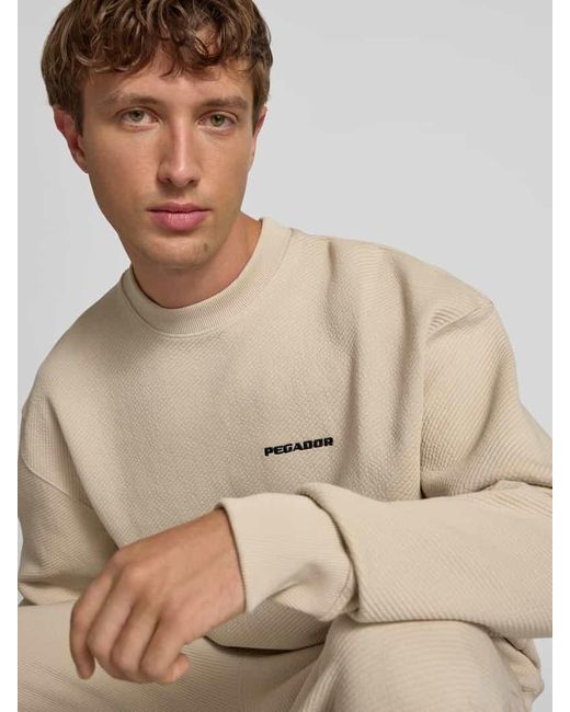 PEGADOR Oversized Sweatshirt mit Logo-Stitching und Rundhalsausschnitt in Natural für Herren