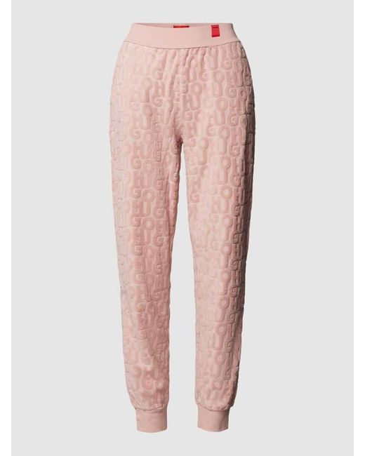 HUGO Pink Jogpants mit Allover-Label-Muster aus Frottee Modell 'TERRY ME'