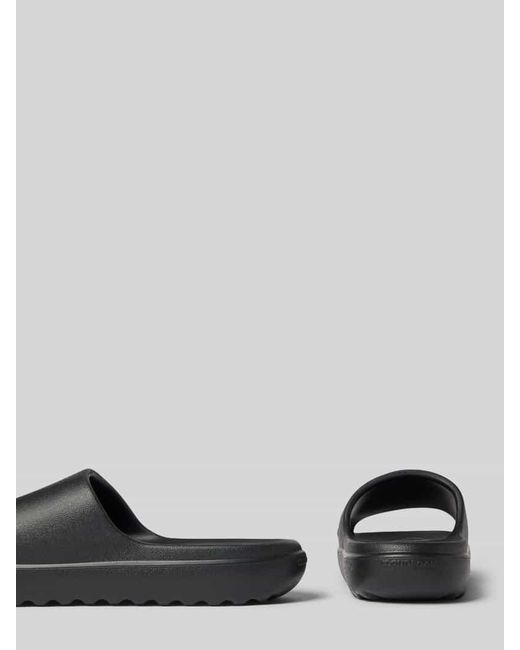 Adidas Gray Slides mit Label-Detail Modell 'ADILETTE LUMIA'