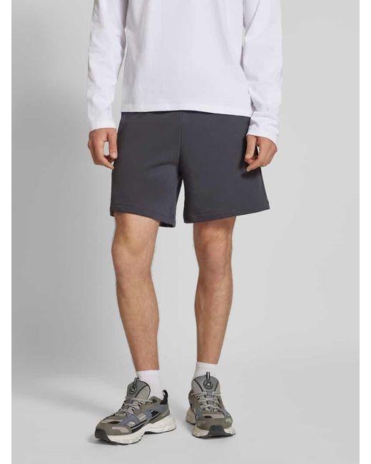 Champion Relaxed Fit Sweatshorts mit Logo-Badge Modell 'Sustainable' in Blue für Herren