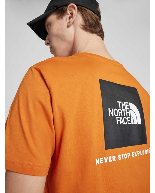 The North Face T-Shirt mit Label-Print Modell 'REDBOX' in Orange für Herren