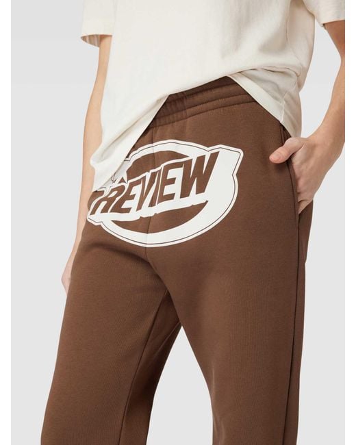 Review Sweatpants Met Gewatteerde Logoprint in het Brown