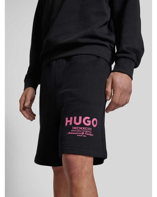 HUGO Baggy Fit Sweatshorts mit Label-Print Modell 'Nomario' in Black für Herren