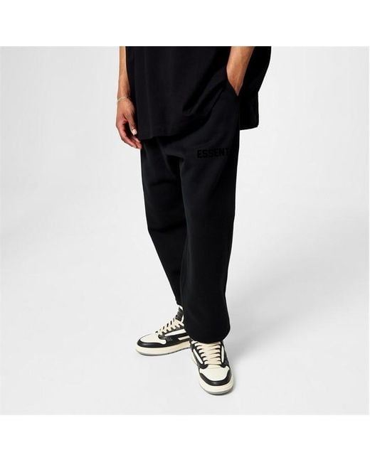 Fear Of God Black Tapered Logo-appliquéd Cotton-blend Jersey Sweatpants for men