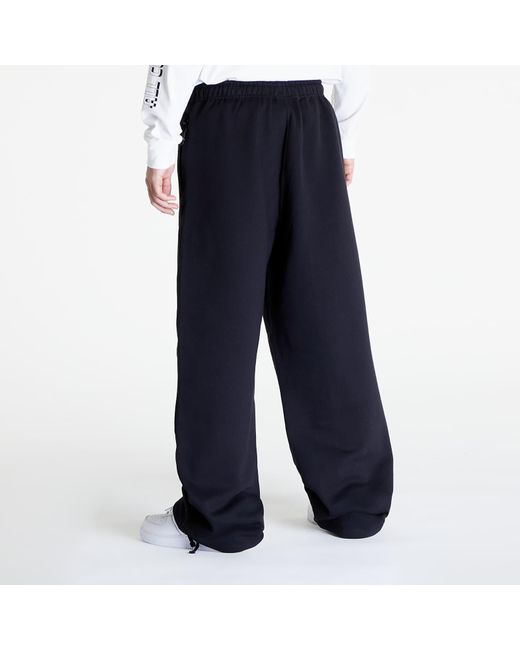 Pantaloni Solo Swoosh Open-Hem Brushed-Back Fleece Pants di Nike in Blue da Uomo