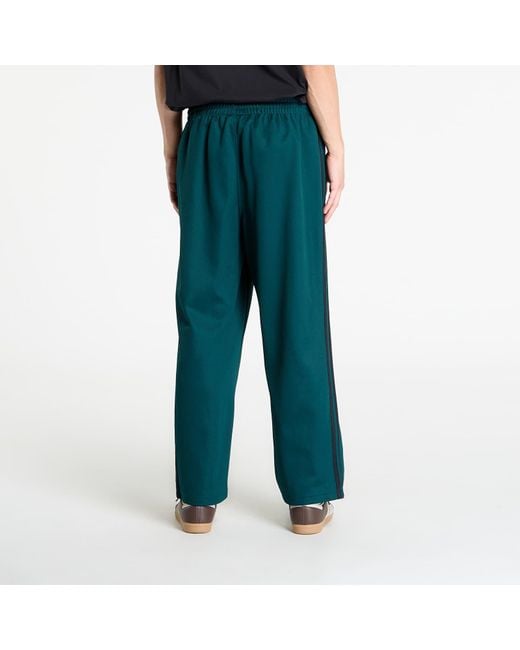 Adidas Originals Green Pants Adidas Adicolor Baggy Fit Firebird Track Pants Aurora Ivy for men