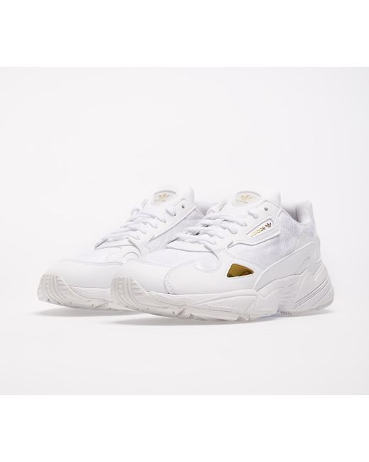 white and gold adidas falcon