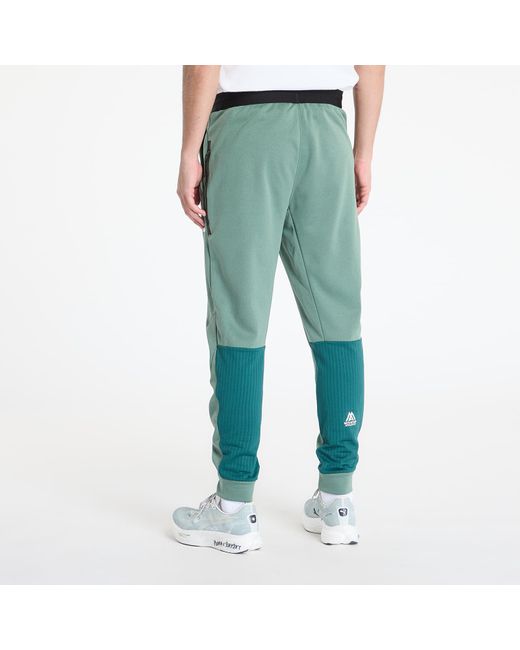 Pantalons mountain athletics fleece pant duck green/ deep nori s The North Face pour homme