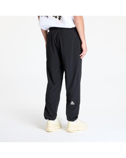 Pantalons mountain athletics wind pant s The North Face pour homme en coloris Blue