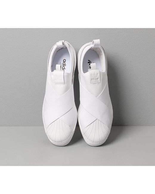 white adidas slip on