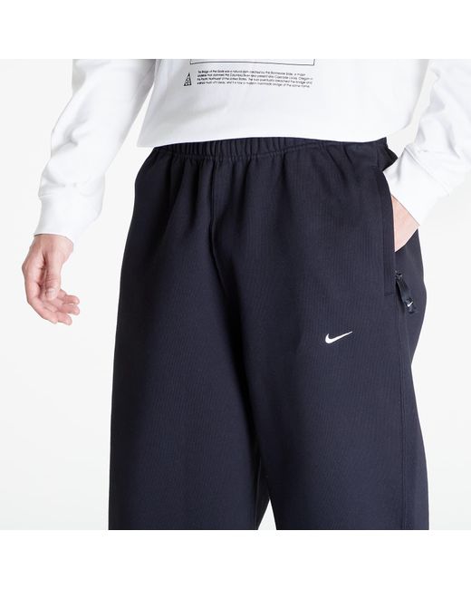 Pantaloni Solo Swoosh Open-Hem Brushed-Back Fleece Pants di Nike in Blue da Uomo