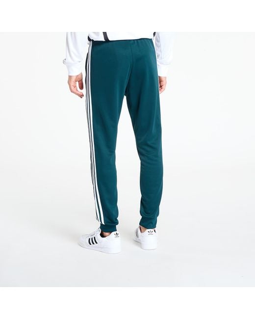 Adidas Originals Broeken Adidas Adicolor Classics Sst Track Pants Aurora Ivy in het Blue voor heren