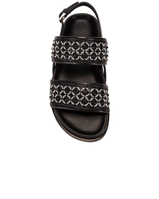 Alaïa Black Eyelet Slingback Sandals