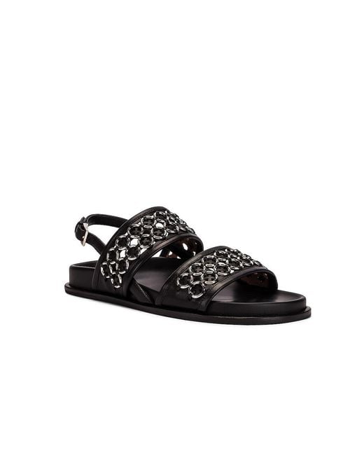 Alaïa Black Eyelet Slingback Sandals