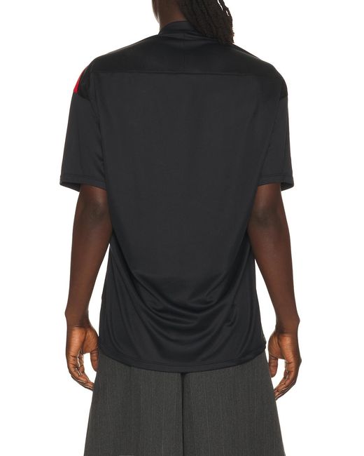 Commission Black Pulled Soccer Tee for men