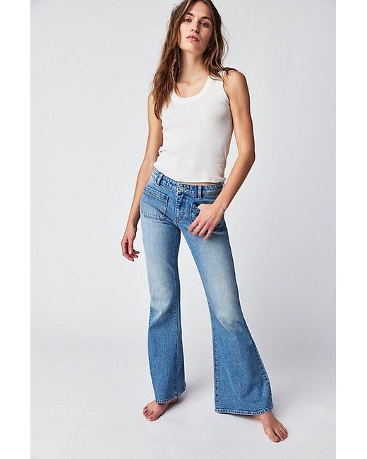 Rolla's East Coast Low-rise Flare Jeans At Free People In Organic Mid Blue, Size: 29